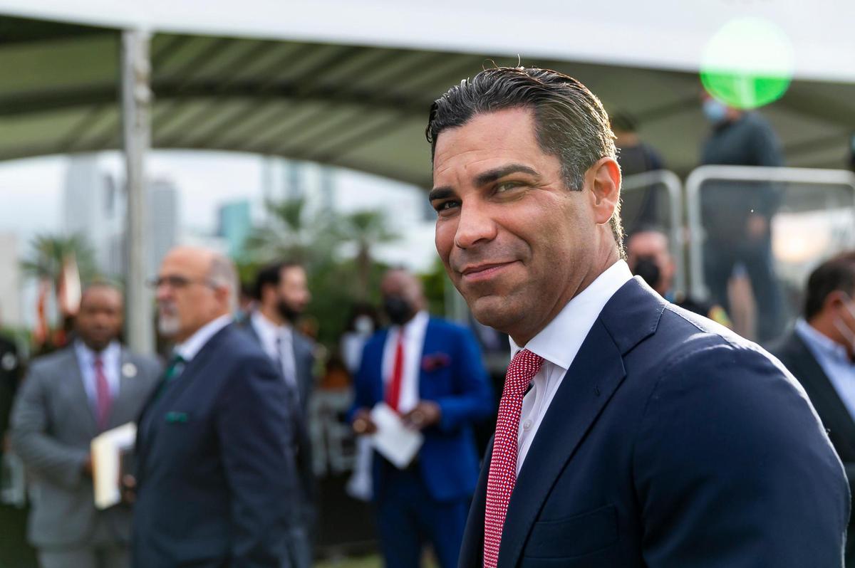 Miami Mayor Francis Suarez greets guests at Maurice A. Ferré Park in downtown Miami on Monday, Jan. 3, before being inaugurated as the 80th president of the U.S. Conference of Mayors.