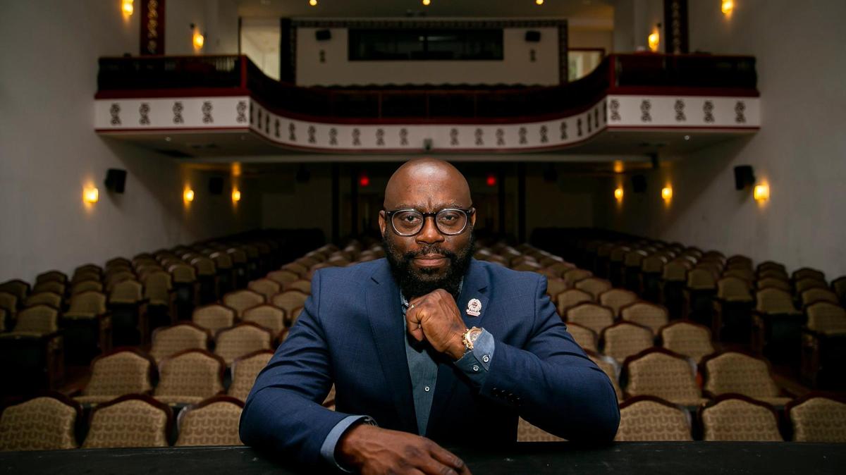 Timothy A. Barber, executive director of the Black Archives History and Research Foundation of South Florida, sits inside the Historic Lyric Theater, part of the Archives, on Wednesday. Barber, who has led the Archives since 2009, is stepping down to become director of Florida Agricultural and Mechanical University’s Meek-Eaton Black Archives Research Center and Museum, whose work encompasses the southeastern United States.