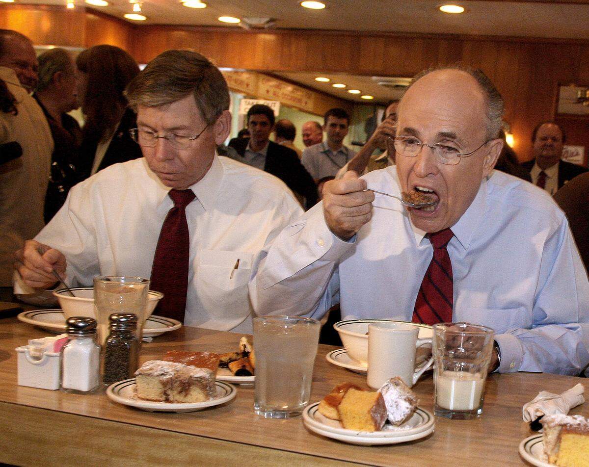 Then-presidential candidate Rudy Giuliani has a bowl of Raisin Bran for breakfast as he campaigns at the Rascal House in Sunny Isles Beach along with Florida Attornet General Bill McCollum.