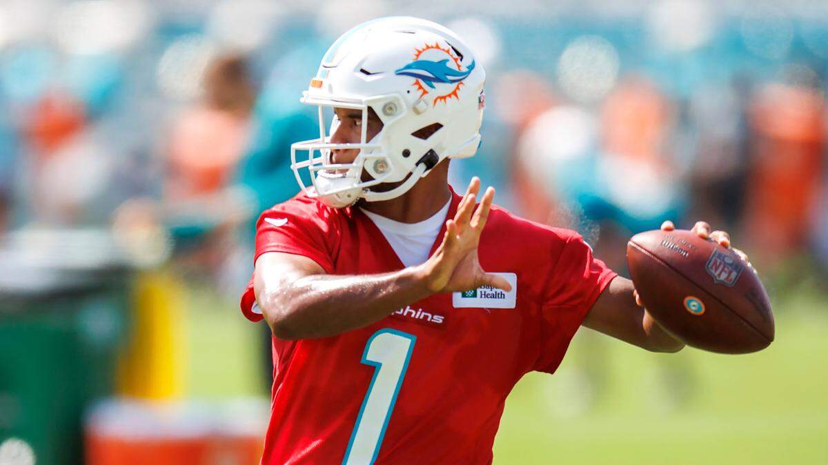 Miami Dolphins quarterback Tua Tagovailoa (1) sets up to pass during NFL football training camp at Baptist Health Training Complex in Hard Rock Stadium on Thursday, July 28, 2022 in Miami Gardens, Florida.