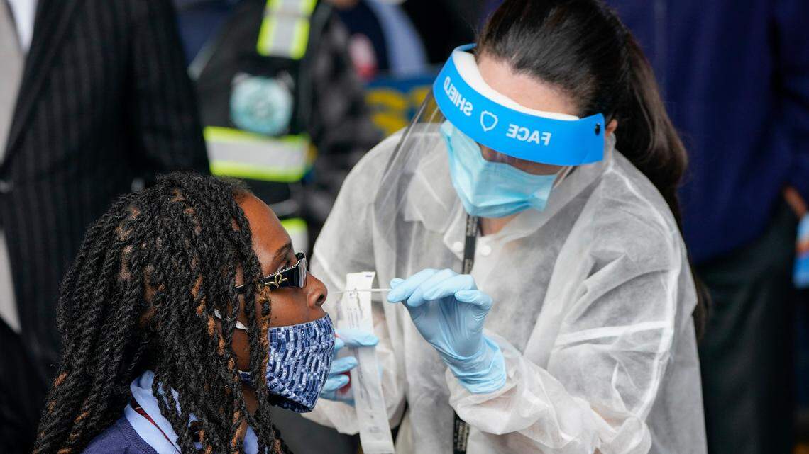 Bus Operator, Cathy Davis-Baker, gets a Covid test as part of an initiative by the Metropolitan Transportation Authority to test its workers Tuesday, Oct. 27, 2020, at the Grand Avenue Bus Depot in New York.