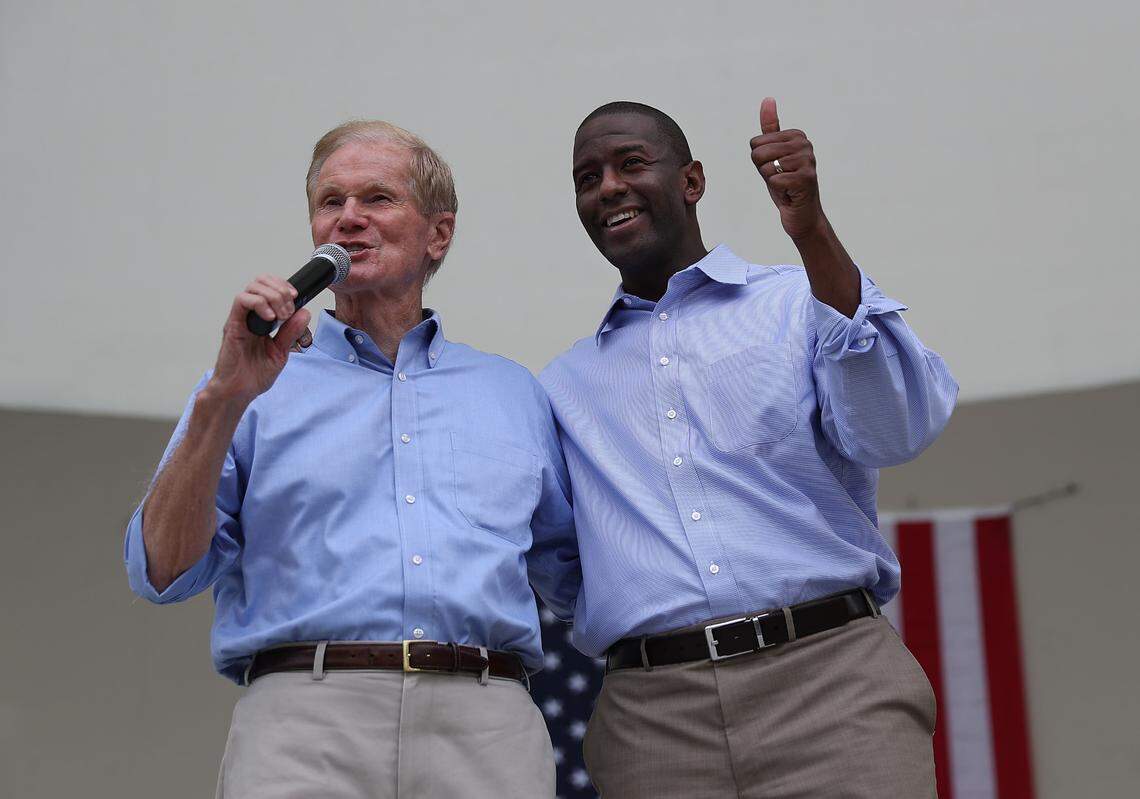 Sen. Bill Nelson, D-Fla., left, and Florida Democratic governor candidate Andrew Gillum campaign together during a Get Out the Vote rally at the Meyer Amphitheatre on Nov. 3, 2018, in West Palm Beach.