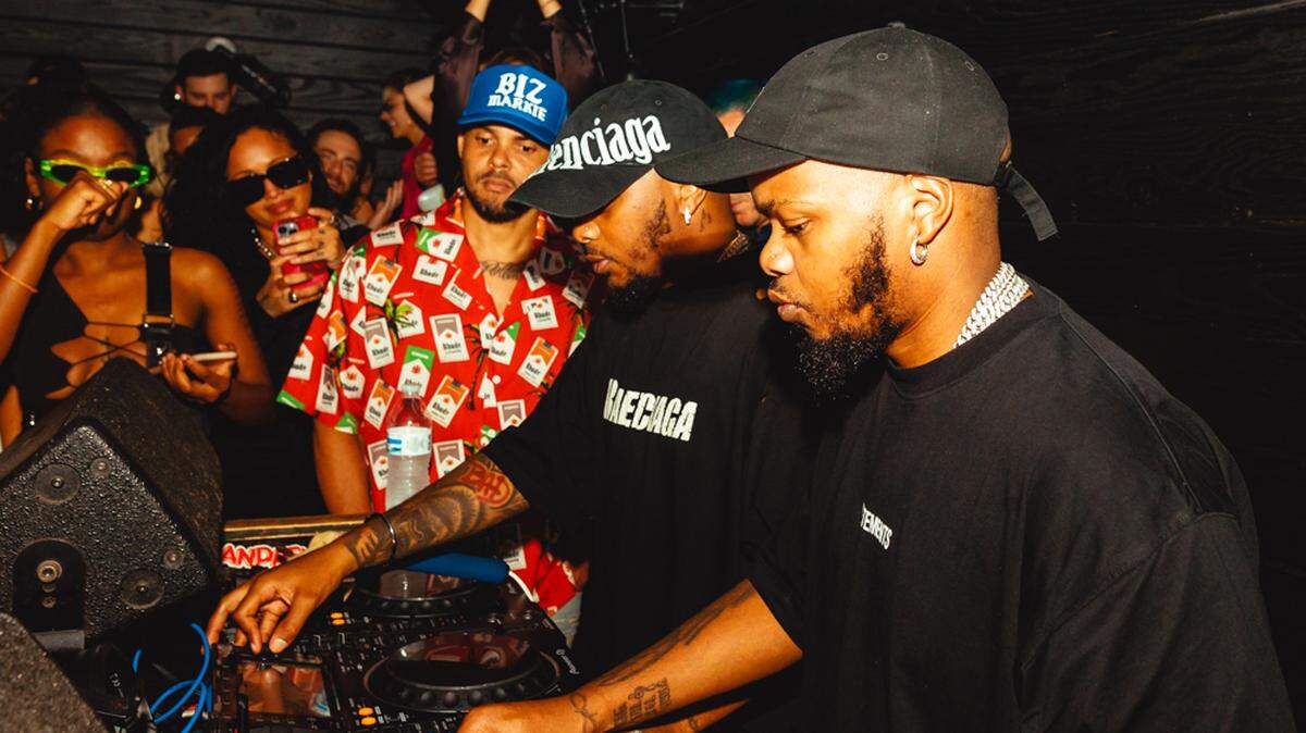 Walshy Fire, left, watches as Major League DJz spin during Miami Music Week 2022. Major League DJz recently dropped an amapiano project entitled “Piano Republik” with Major Lazer, the DJ trio of which Walshy Fire is a member.