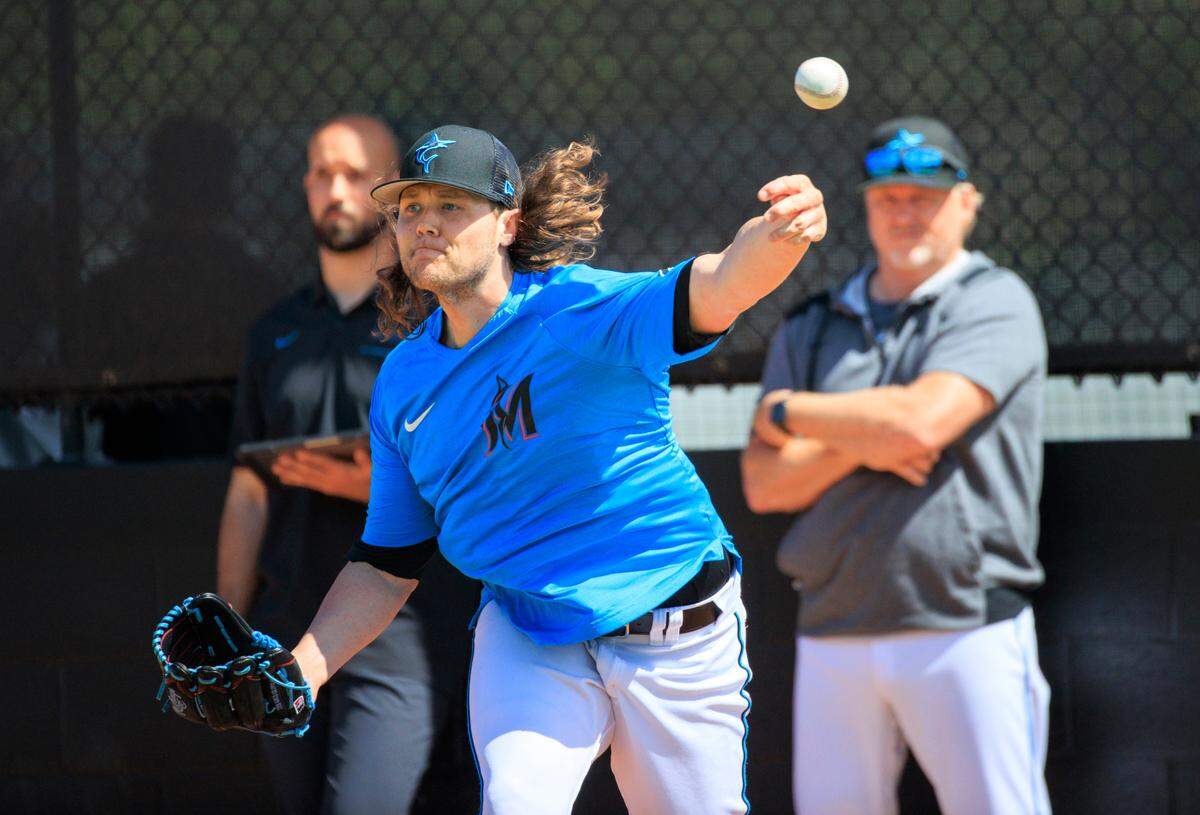 Miami Marlins pitching coach Mel Stottlemyre Jr look as Marlins pitcher Steven Okert throws during the first full-squad spring training workout at Roger Dean Stadium on Monday, March 14, 2022 in Jupiter, FL.