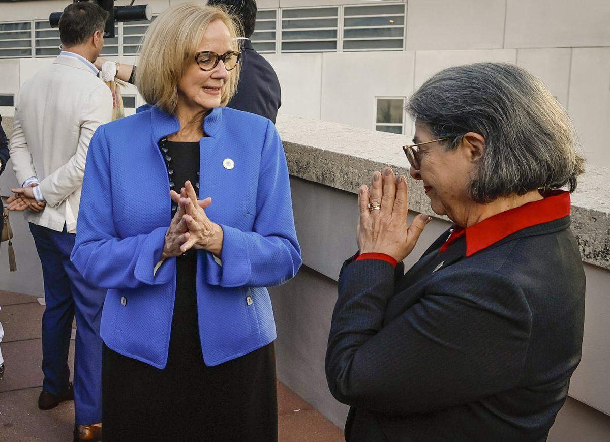 City of Miami Mayor Eileen Higgins, at left, is greeted by Miami-Dade County Mayor Daniella Levine Cava, right, at the reception that followed the conclusion of the installation ceremony for Eileen Higgins as the Mayor of the City of Miami at the Miami-Dade College Wolfson Campus Auditorium in Miami, Florida, on Thursday, December 18, 2025. 