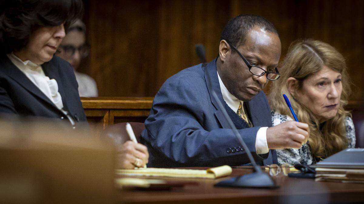 Miami, FL, October 28, 2025 - Flanked by his attorneys, Labrant Dennis, center, takes notes during court proceedings at Miami-Dade County Court.
Jurors will decide if Labrant Dennis, convicted of fatally bludgeoning his ex-girlfriend and a UM football player she was seeing, will be sent back to Florida's Death Row. 