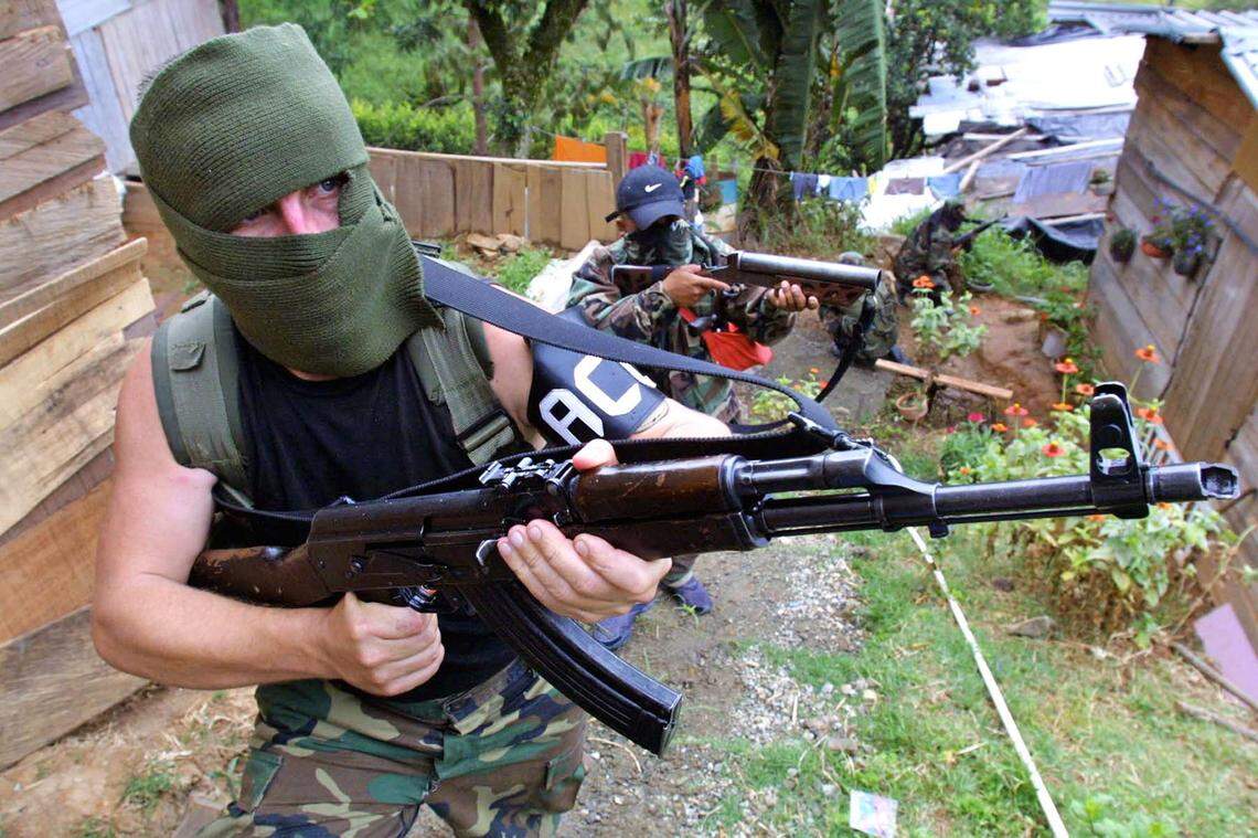 This July 2002 file photo shows members of the United Self-Defense Forces of Colombia, known by its initials in Spanish as AUC.