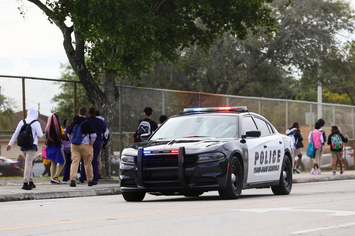 A Miami-Dade Schools Police vehicle cruises outside Miami Northwestern Senior High in Miami on Friday, Jan. 12, 2024.