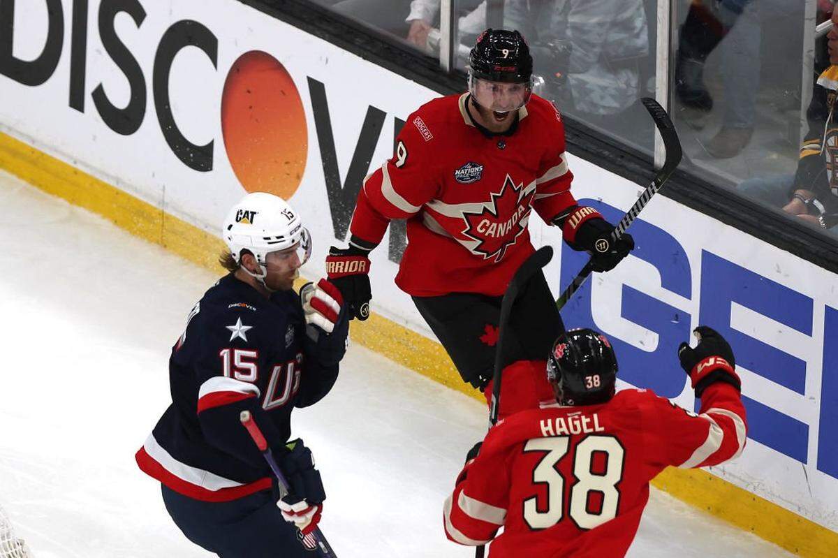 BOSTON, MASSACHUSETTS - FEBRUARY 20: Sam Bennett #9 of Team Canada celebrates with Brandon Hagel #38 after scoring a goal against Connor Hellebuyck #37 of Team United States during the second period in the NHL 4 Nations Face-Off Championship Game at TD Garden on February 20, 2025 in Boston, Massachusetts. (Photo by Maddie Meyer/Getty Images)