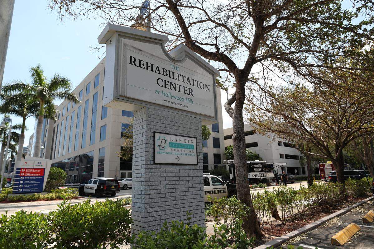 In this 2017 photograph, Hollywood police respond to the Rehabilitation Center at Hollywood Hills, a nursing home where 12 residents died a few days after Hurricane Irma knocked out power to the facility’s air-conditioning system. Four former employees of the nursing home were charged with aggravated manslaughter on Tuesday.