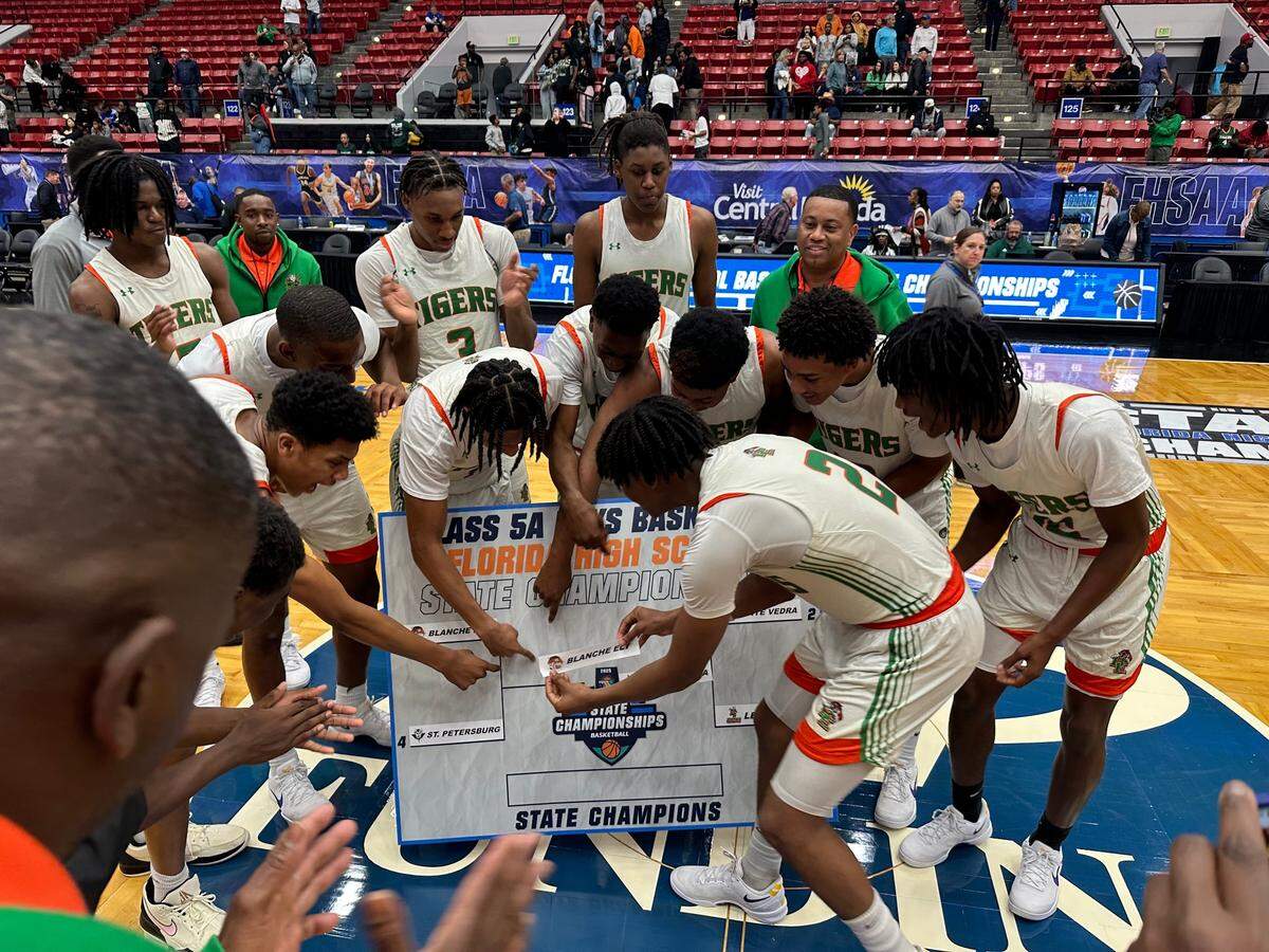 Blanche Ely’s boys’ basketball team celebrates after beating St. Petersburg on Wednesday in a Class 5A state semifinal at the RP Funding Center in Lakeland, Fla.
