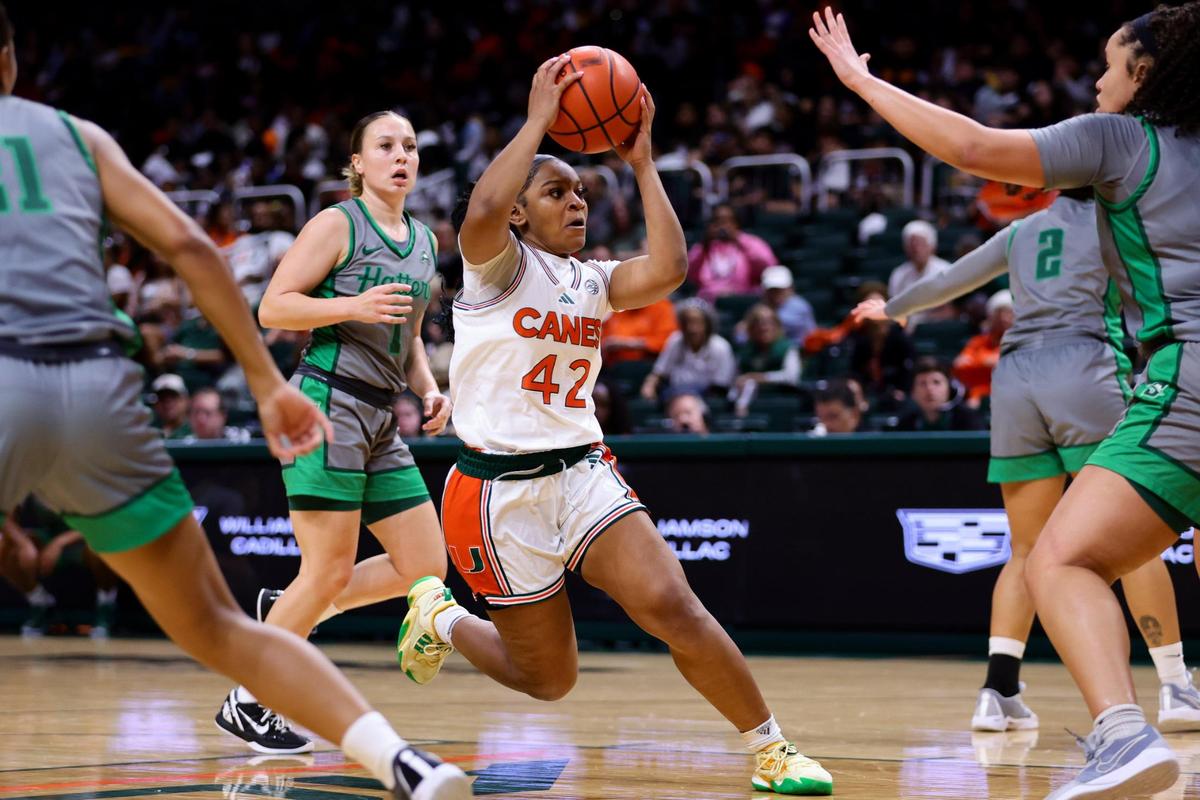 Miami Hurricanes guard Leah Harmon (42) drives to the basket against the Stetson Hatters during the first quarter at the Watsco Center in Coral Gables, Florida, Monday, November 4, 2024.