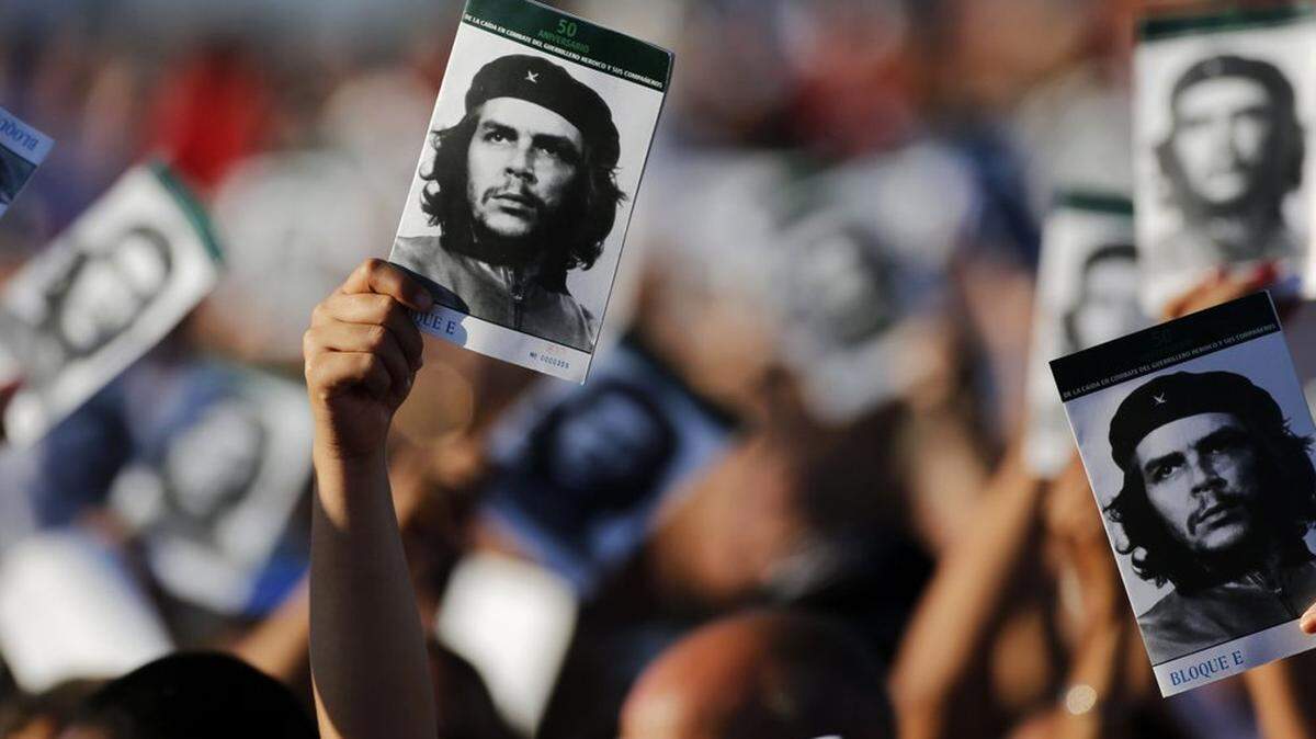 In 2017, Bolivians wave pictures at an event paying tribute to Cuban Revolution hero Ernesto “Che” Guevara marking the 50th anniversary of his death in Santa Clara, Cuba.