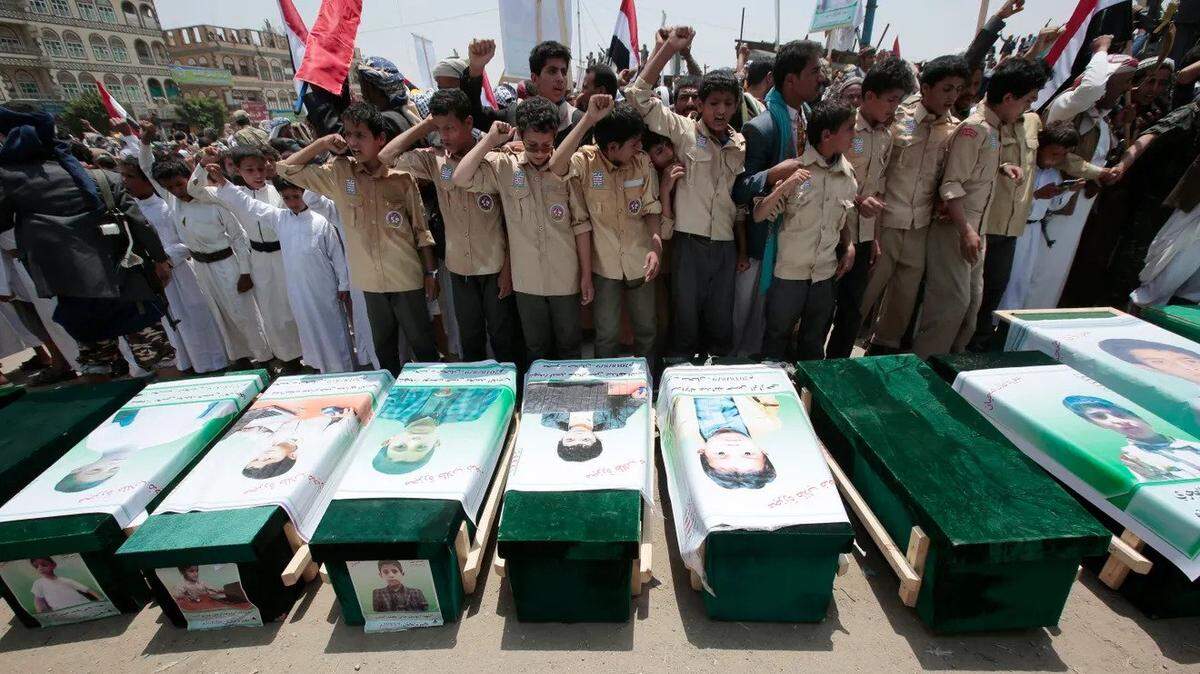 Yemenis attend funeral for the victims of a Saudi-led airstrike.