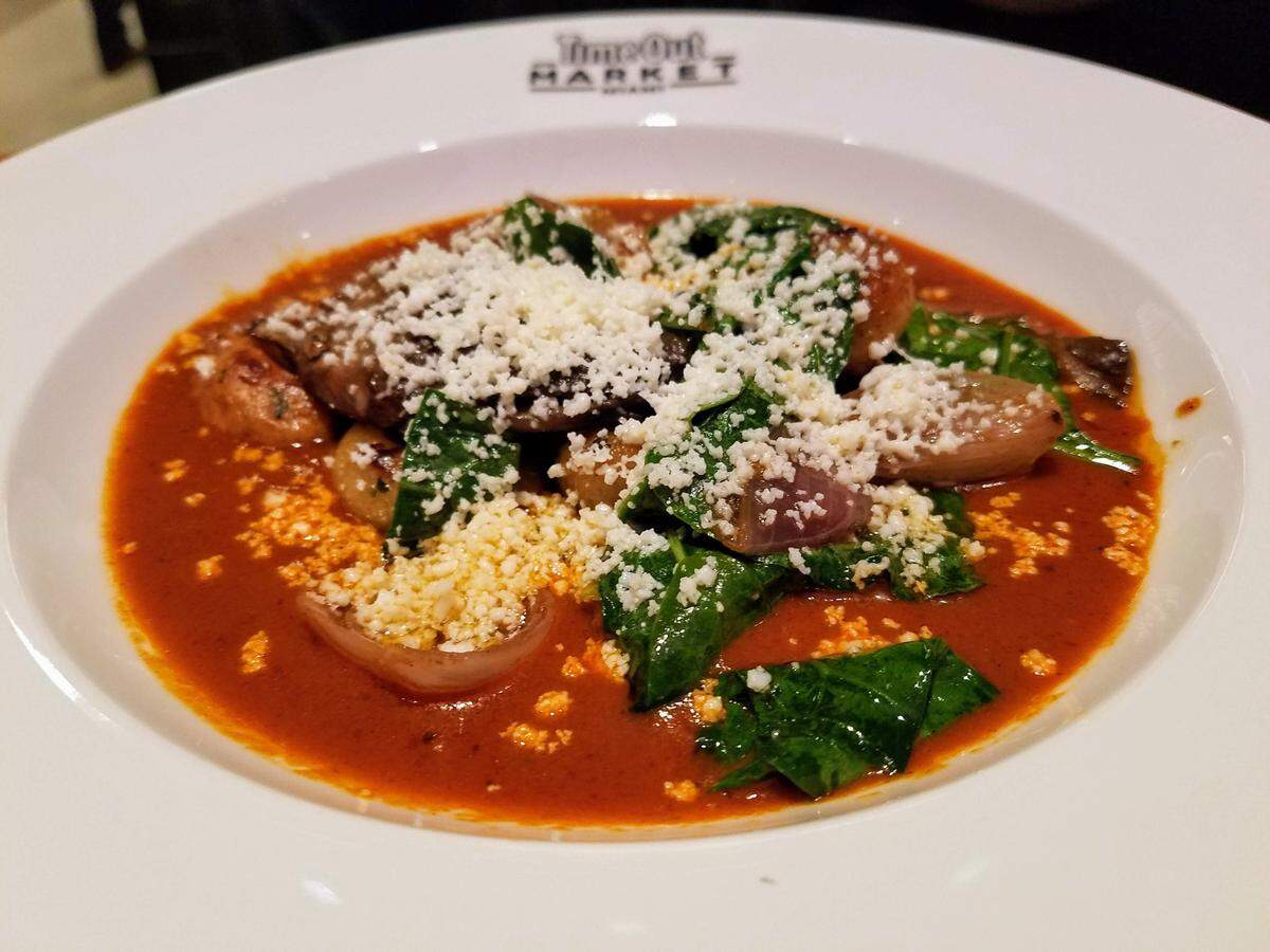 Pan-seared chochoyotes are dumplings in mole with mushrooms, spinach and cojita cheese, from Miguel Massens, who has a three-month residency in the Time Out Market test kitchen.