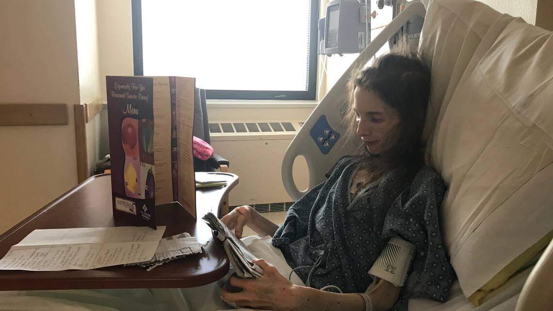 Katrina Howard, 25, reads her journal in a hospital room at Tallahassee Memorial Hospital. Severely anorexic, Howard was admitted three weeks ago after her local hospital in Americus, Ga., recommended she seek medical treatment out-of-state or go home, she said.