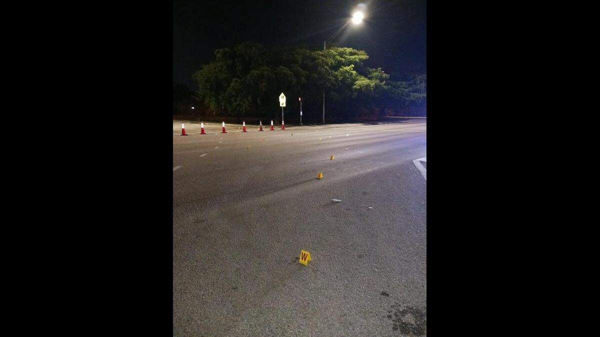 Markers for the shell casings found by Florida Highway Patrol after the overnight shooting in Fort Lauderdale.