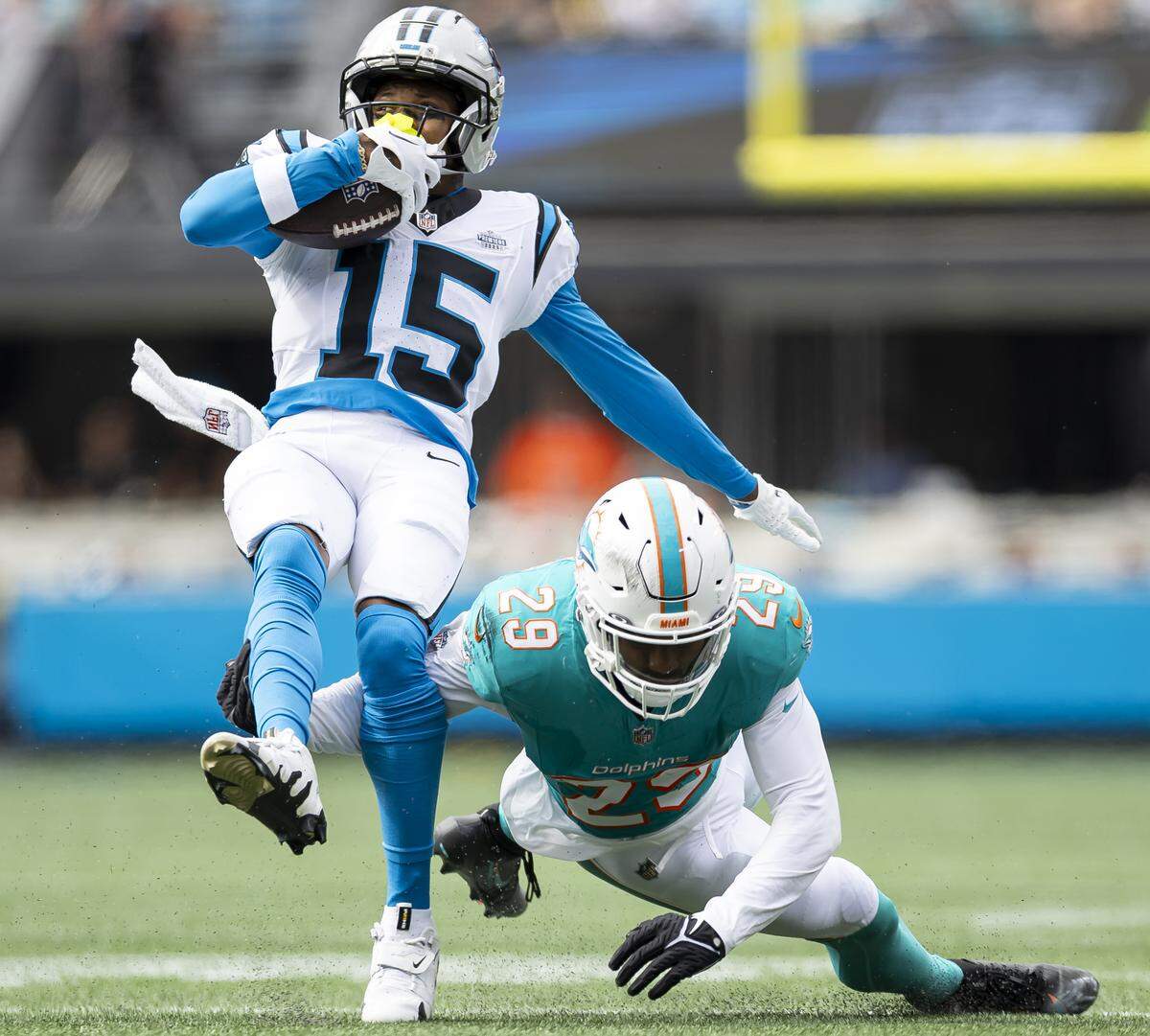 Miami Dolphins free safety Minkah Fitzpatrick (29) tackles Carolina Panthers wide receiver Jimmy Horn Jr. (15) in the second half of their NFL game at the Bank of America Stadium on Sunday, Oct. 5, 2025, in Charlotte, N.C.