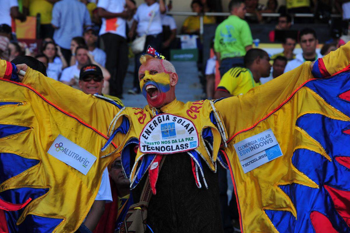 Colombian fan, called El Cole, cheers for his national team before the start of the match Colombia vs Uruguay qualifyng for the Brazil 2014 World Cup South American round, at the Metropolitano Stadium in Barranquilla on September 9, 2012. AFP PHOTO/Luis Acosta        (Photo credit should read LUIS ACOSTA/AFP/GettyImages)