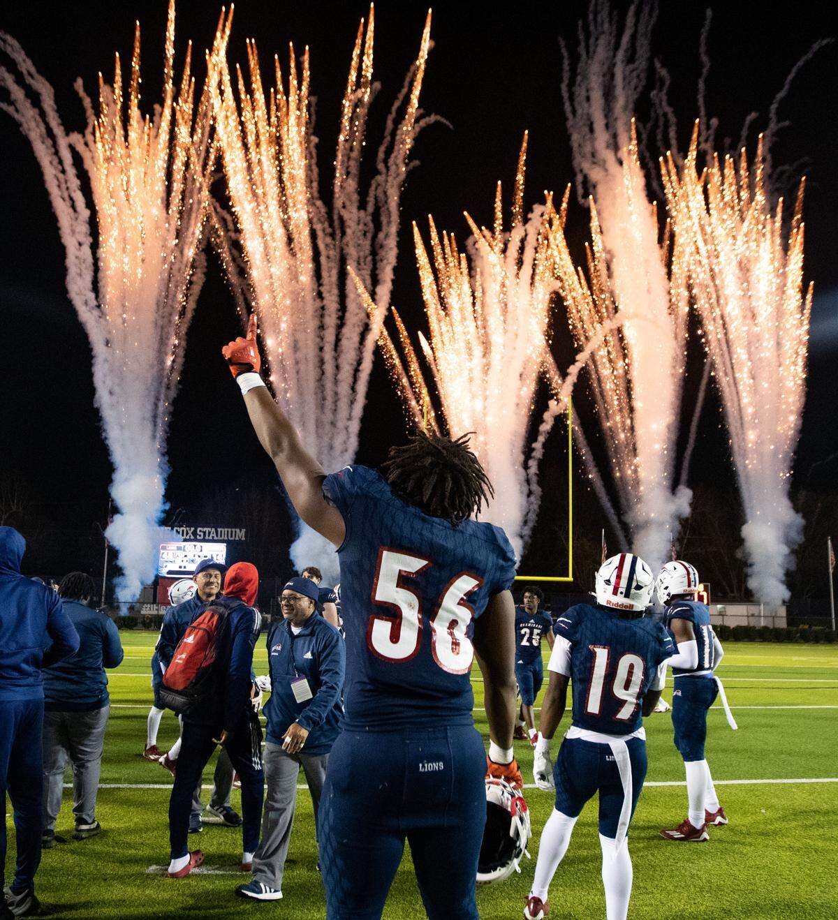 Chaminade-Madonna coaches and players celebrate their win. The Chaminade Lions defeated the Clearwater Central Catholic Marauders 48-14 to claim the title of Class IM State Champions at Gene Cox Stadium in Tallahassee, Florida on Thursday, Dec. 8, 2022.