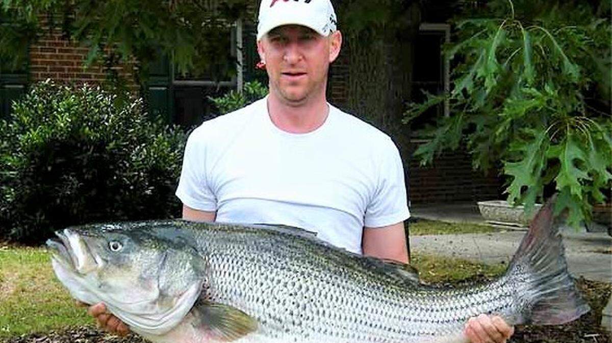 PGA Tour pro Vaughn Taylor of Augusta, Georgia, holds the mount of his 56-pound, 2-ounce striped bass that was a record for the Savannah River. Taylor was fishing for stripers a few years later when his bass boat took on water, forcing him to jump into the river.