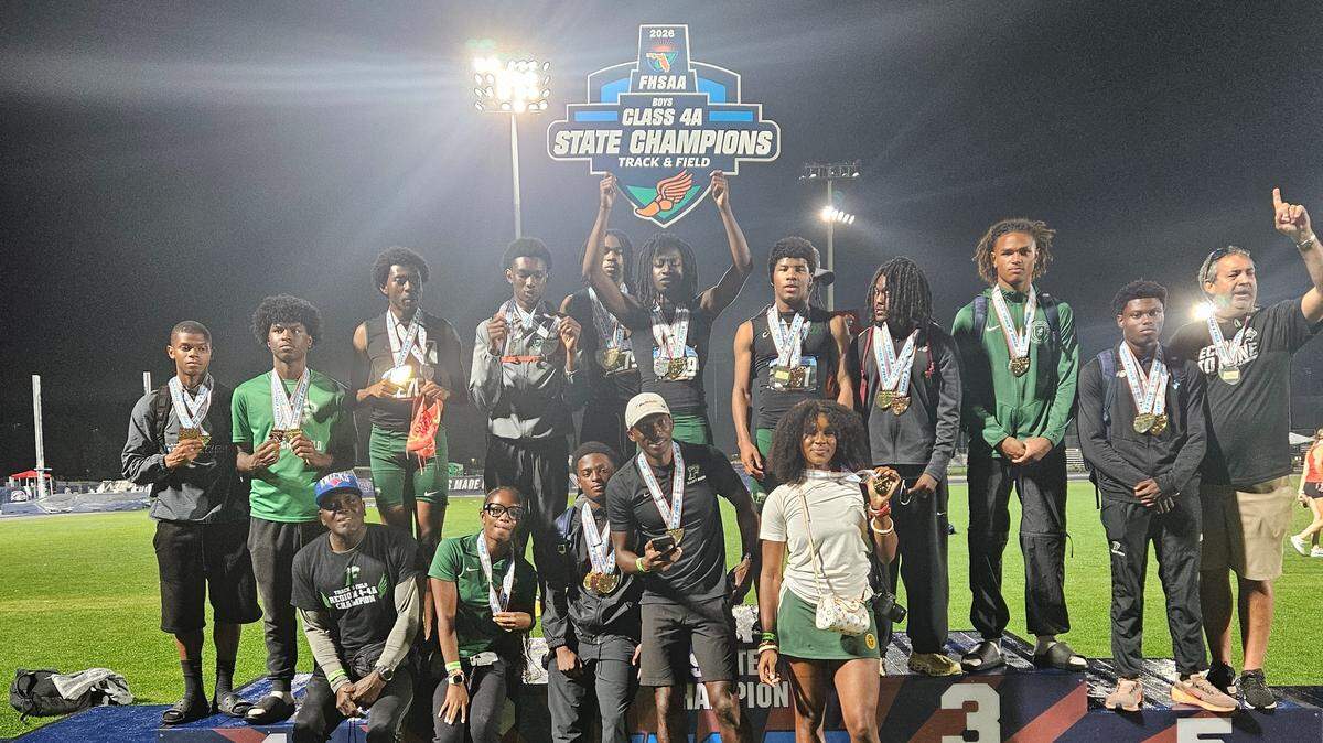 The Flanagan boys’ track and field team celebrates its first state championship on Saturday at Hodges Stadium at UNF in Jacksonville, Fla.