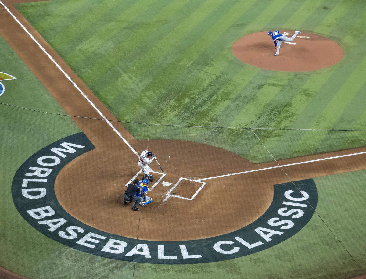 Venezuela starting pitcher Eduardo Rodriguez (52) pitches against United States right fielder Aaron Judge (99) in the first inning of their World Baseball Classic final game at loanDepot Park on Tuesday, March 17, 2026, in Miami, Fla.