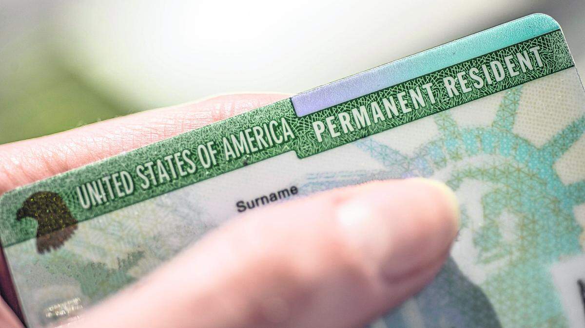 Federal agents arrested a former member of the Cuban intelligence agency for fraudulently obtaining a green card to live legally in the United States.
