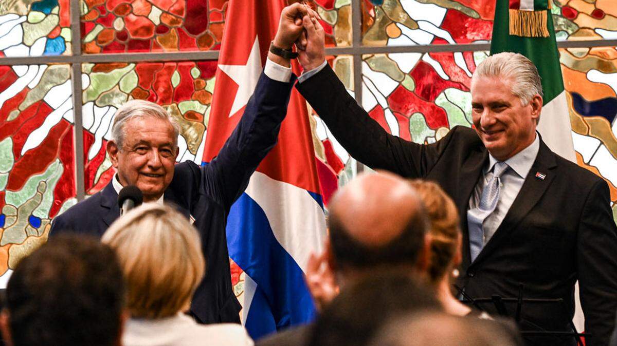 In May, Mexico’s President Andrés Manuel López Obrador, left, raises arms with Cuban President Miguel Díaz-Canel. The Mexican leader was awarded the Jose Marti Order in Havana.