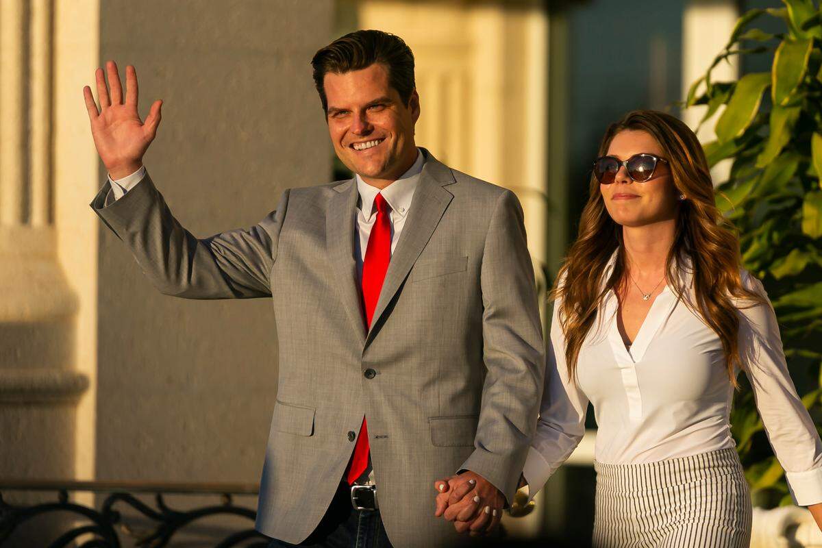 U.S. Representative Matt Gaetz and his fiance Ginger Luckey arrive to the “Save America Summit” at the Trump National Doral Resort in Doral on Friday, April 9, 2021.