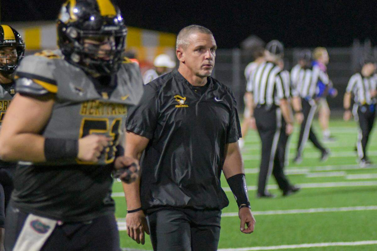 Plantation American Heritage coach Mike Smith on the sidelines in a Class 2M state semifinal game against Jacksonville Bolles on Friday, Dec. 2, 2022, at American Heritage School in Plantation, Florida.