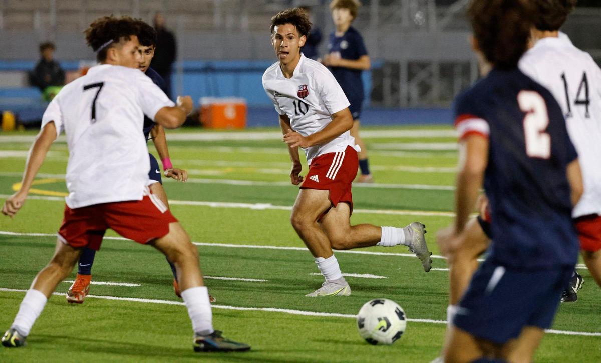 Miami Beach Mathew Brid (10) kicks the ball as Columbus players defend during the GMAC soccer championship games at Traz Powell Stadium in Miami on Friday, January 13, 2023.