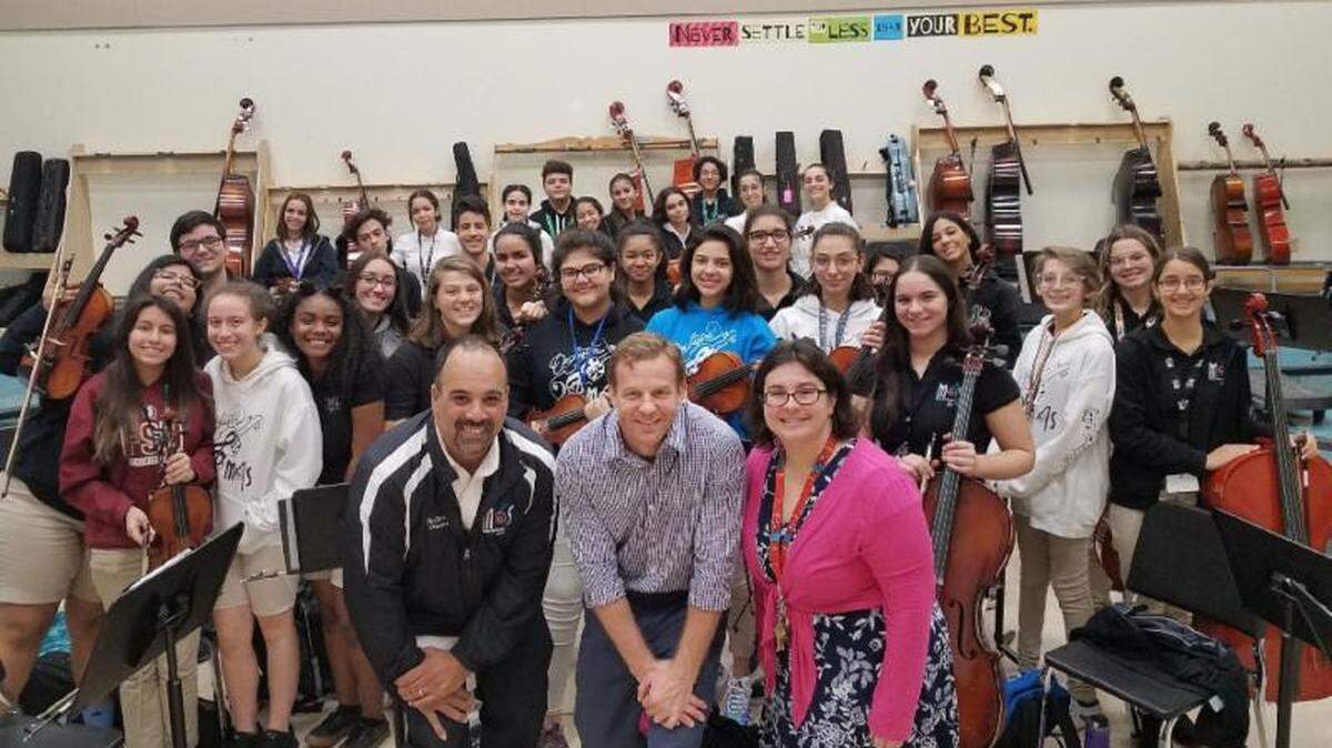 Vivian Gonzalez, a music teacher at the Miami Arts Studio 6-12 at Zelda Glazer, was named a 2018 Music Educator Innovator by the Give A Note Foundation for her organization, Music Arts Studio Orchestra Outreach. With the MAS Orchestra are, from left, Sean Smith, chairman of the Give A Note Foundation, Vivian Gonzalez and Principal Miguel Balsera.