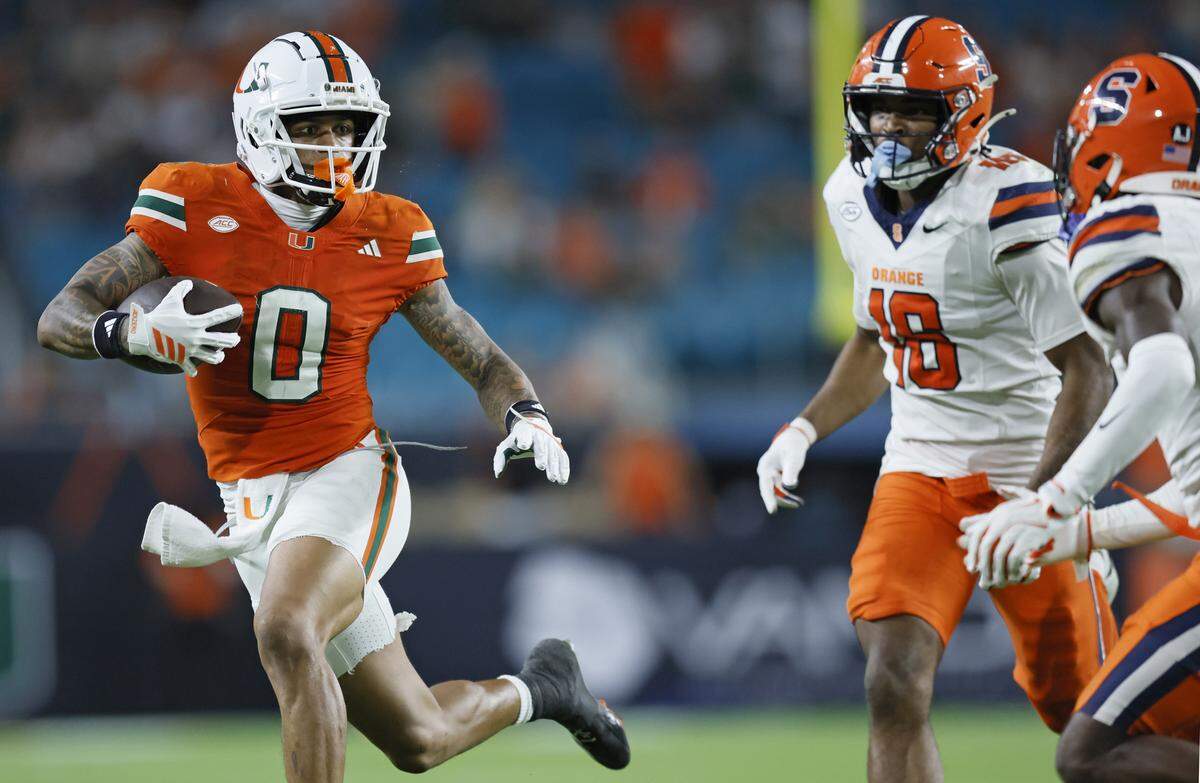 Miami Hurricanes wide receiver Keelan Marion (0) on a pass reception for a first down against the Syracuse Orange in the second half of an NCAA football game at Hard Rock Stadium in Miami Gardens, Florida on Saturday, November 8, 2025.