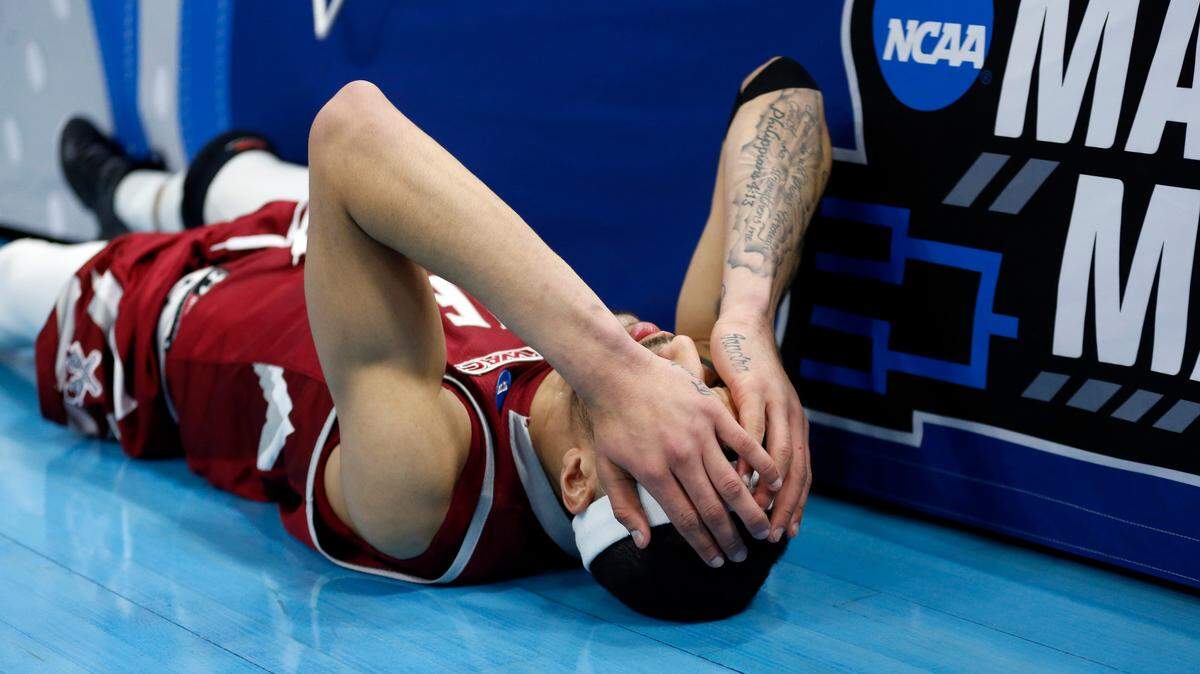 New Mexico State guard Trevelin Queen falls to the court after missing the final shot in the second half during a first round men’s college basketball game against Auburn in the NCAA Tournament, Thursday, March 21, 2019, in Salt Lake City.