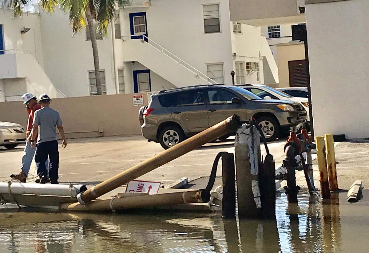 Sitting water will make it more dangerous for crews to assess and repair the damages after a garbage truck knocked down a power pole, sending it crashing onto a duplex and downing power lines.