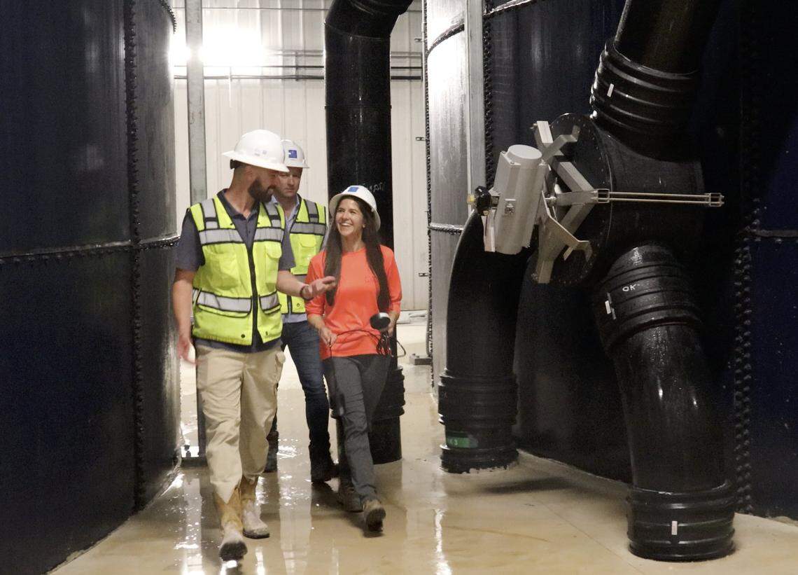 Operation manager, Ryan Rubino, left, Johan Andreassen, center, and Christina Belfranin, lab manager, pass near the large tanks at Atlantic Sapphire, one of the world’s largest land-based salmon farms, that is under development in the Homestead area where 2.5 million salmon are being harvested and will complete Phrase 1 in July, 2020.