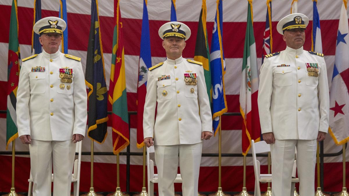 From left to right, U.S. Coast Guard Rear Adm. Peter J. Brown, U.S. Coast Guard Rear Adm. Eric J. Jones, and U.S. Coast Guard Seventh District chaplain Alan Cameron at Coast Guard Air Station Miami in Opa-locka, Florida, on Wednesday, June 19, 2019. Brown will be stepping down as Commander of the U.S. Coast Guard Seventh District, and will be replaced by Jones.