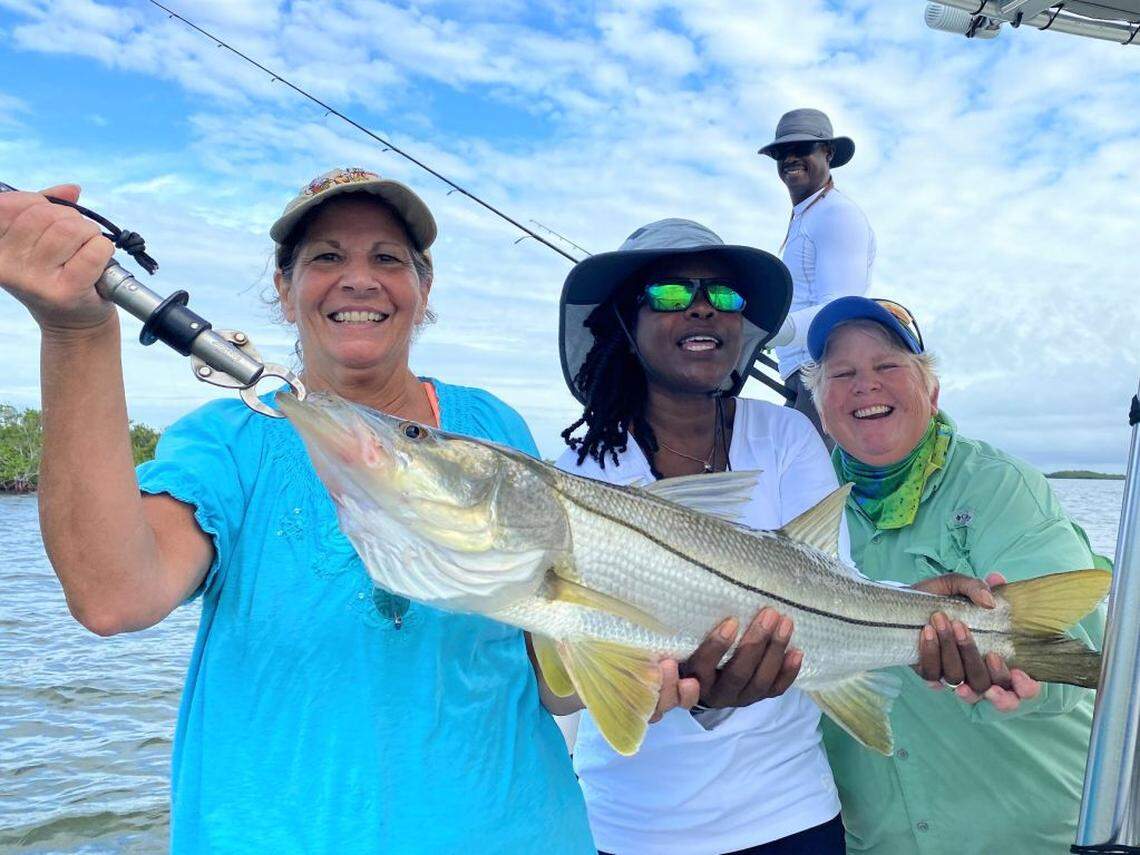 Second-place&nbsp;inshore fishing winner Anita Laico, celebrating with Kristin Hudson, Mary Jane Provencher and Roy Hudson, caught a 31-inch snook on Capt. Chris Hanson’s Scales 2 Tales.