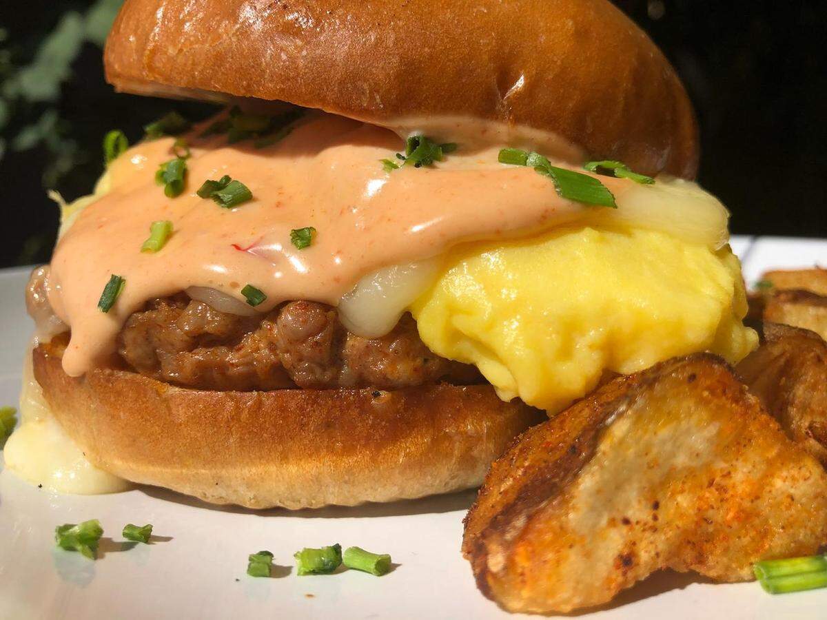 The Matador at The Egg Spot stars cage free scrambled eggs, pepper jack cheese, Butcher Shop fresh chorizo, and chipotle aioli on a warm brioche bun.