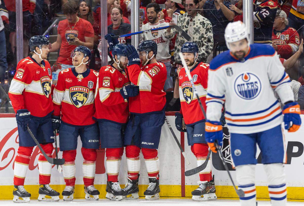 Florida Panthers center Carter Verhaeghe (23) celebrates with his teammates after scoring a goal against the Edmonton Oilers in the first period of Game 1 of the NHL Stanley Cup Finals at the Amerant Bank Arena on Saturday, June 8, 2024, in Sunrise, Fla.
