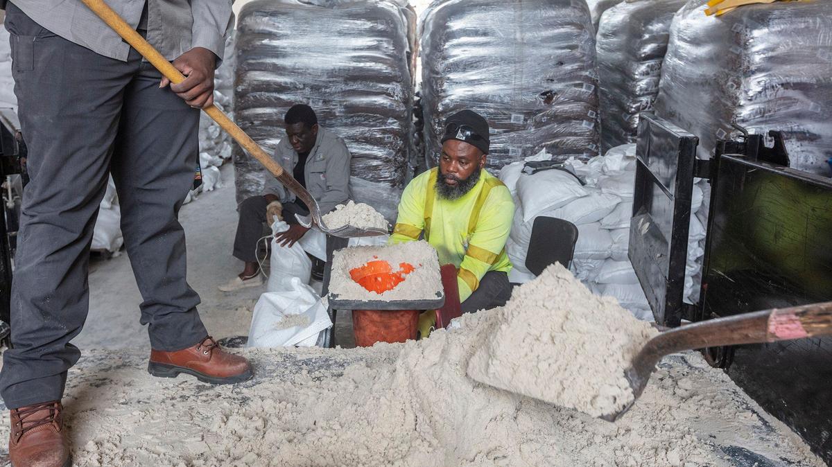 Workers from the City of North Miami Beach prepare sandbags to distribute to residents before the expected flooding ahead of the anticipated Hurricane Milton. The distribution was at 1965 NE 151st St., North Miami Beach, on Saturday Oct. 5, 2024.