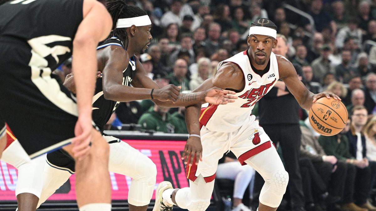 Miami Heat forward Jimmy Butler (22) drives against Milwaukee Bucks guard Jrue Holiday (21) in the first half during game one of the 2023 NBA Playoffs at Fiserv Forum.