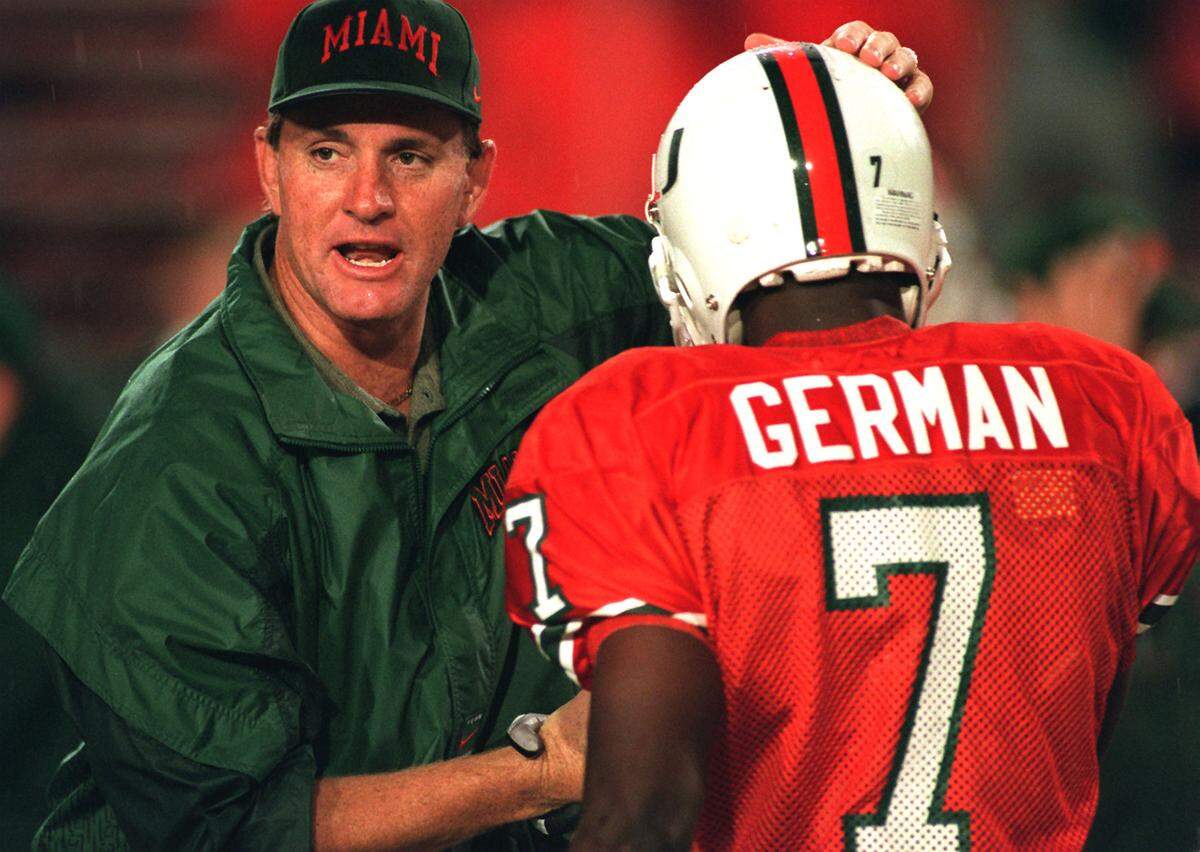 PHOTO BY DAVID BERGMAN/HERALD STAFF - HURRICANE'S HEAD COACH BUTCH DAVIS TALKS WITH JAMMI GERMAN DURING SATURDAY NIGHT'S GAME AGAINST RUTGERS.