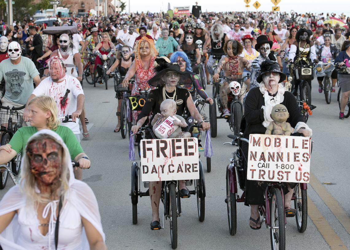 Costumed participants pedal Sunday, Oct. 20, 2019, during the Fantasy Fest Zombie Bike Ride in Key West, Fla. Some 11,000 “zombies” cycled in the event that coincided with the beginning weekend of Key West’s annual Fantasy Fest costuming and masking celebration that continues through Sunday, Oct. 27.
