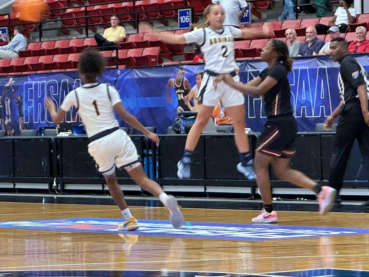 St. Thomas Aquinas guard Jaelyn Cardoza leaps while defending with full court pressure on Thursday during the Raiders’ 62-35 win over Wekiva in a Class 6A girls basketball state semifinal at the RP Funding Center in Lakeland, Fla.
