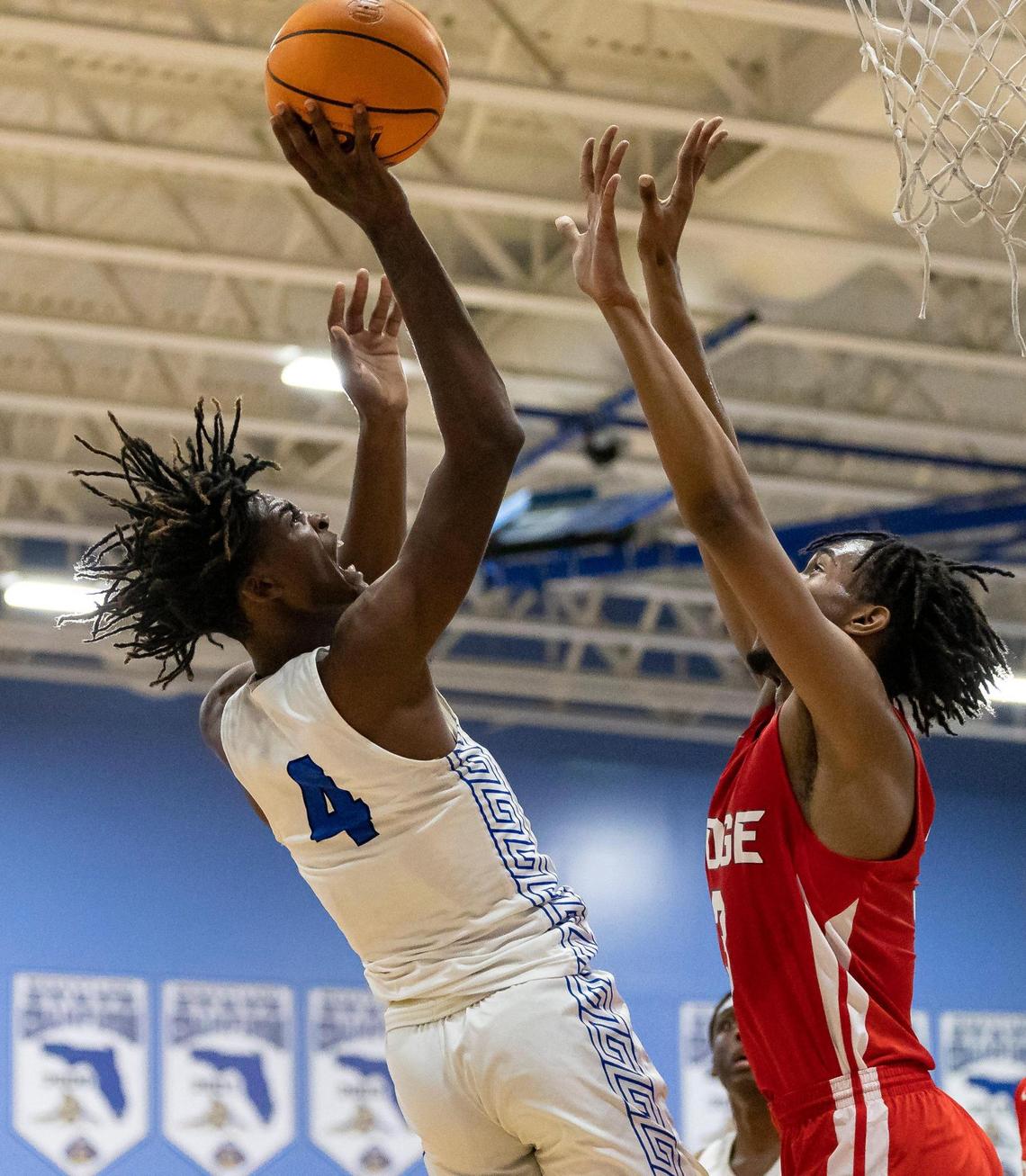South Dade Buccaneers Mister Dean (4) takes a shot as Southridge Spartans Keyonte Green (0) defends during the first half of a GMAC quarter-finals basketball game at South Dade High School on Tuesday, Jan. 24, 2023, in Homestead, Fla.