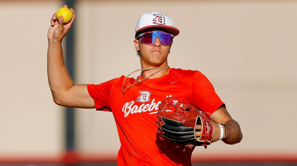Doral Academy shortstop Adrian Santana (8) plays his position during baseball practice at Doral Academy High School in Doral, Florida on Tuesday, February 7, 2023.