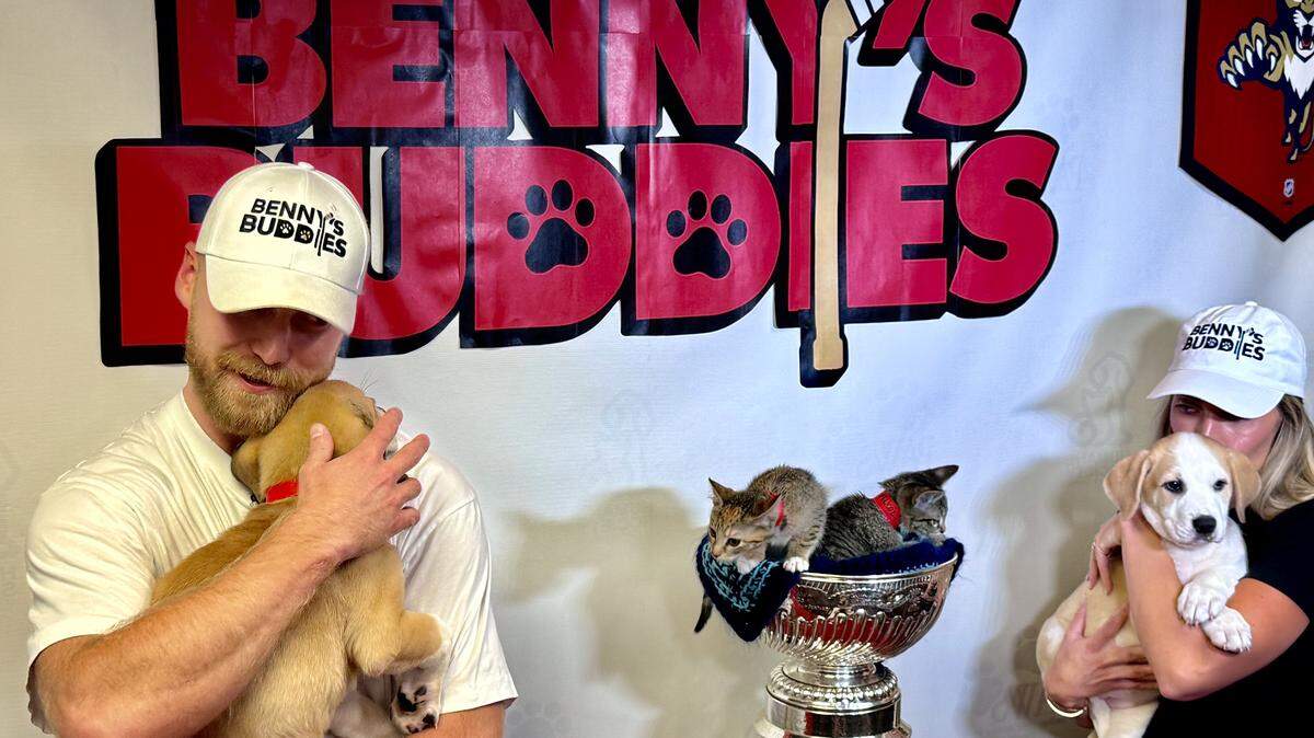 Florida Panthers forward Sam Bennett and his wife Zoe hold Pebbles and Peanut at the Humane Society of Broward County on Wednesday, Sept. 10, 2025.