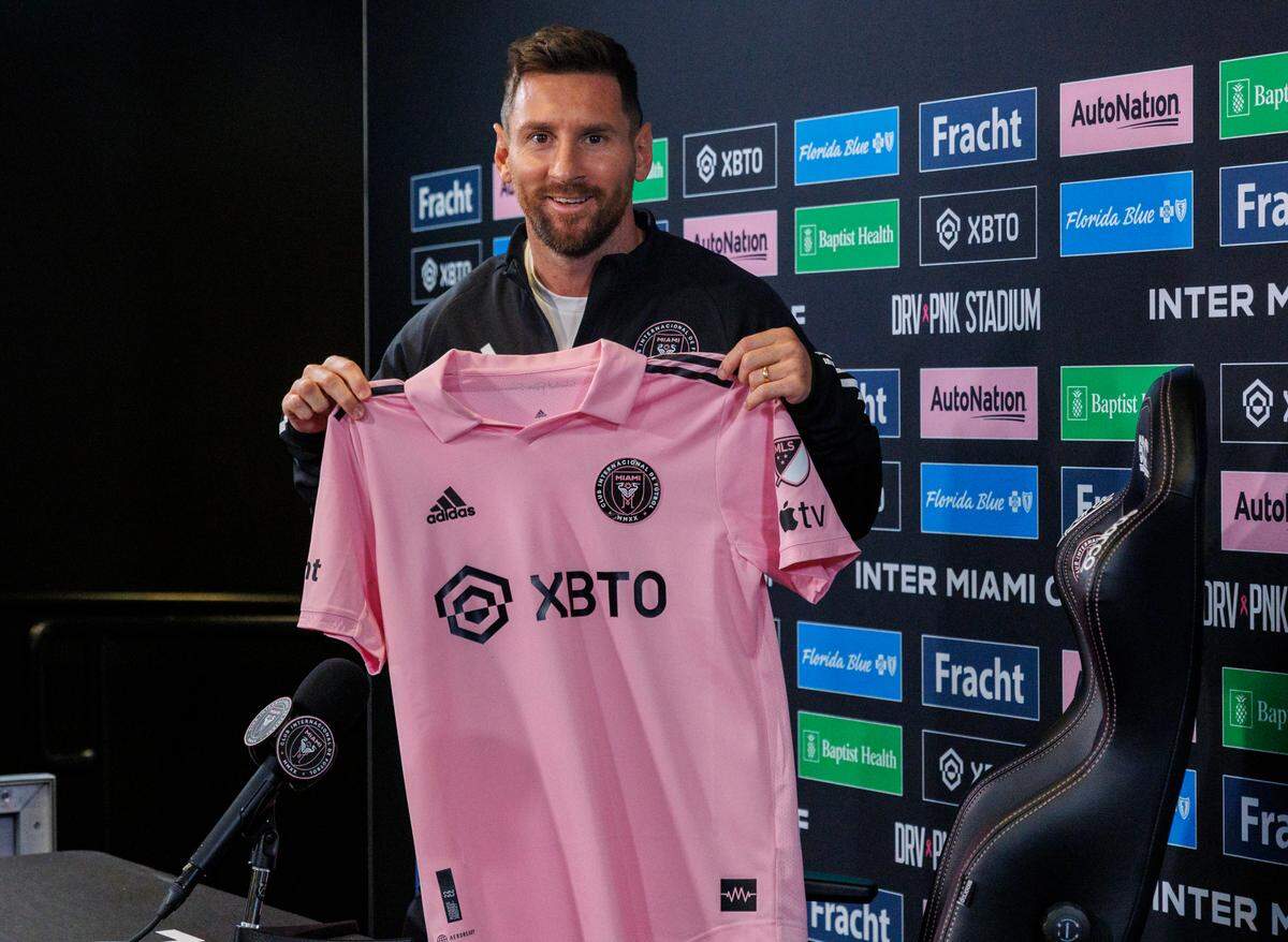 Inter Miami forward Lionel Messi poses with his jersey during a press conference at DRV PNK Stadium on Thursday, Aug. 17, 2023, in Fort Lauderdale, Fla.